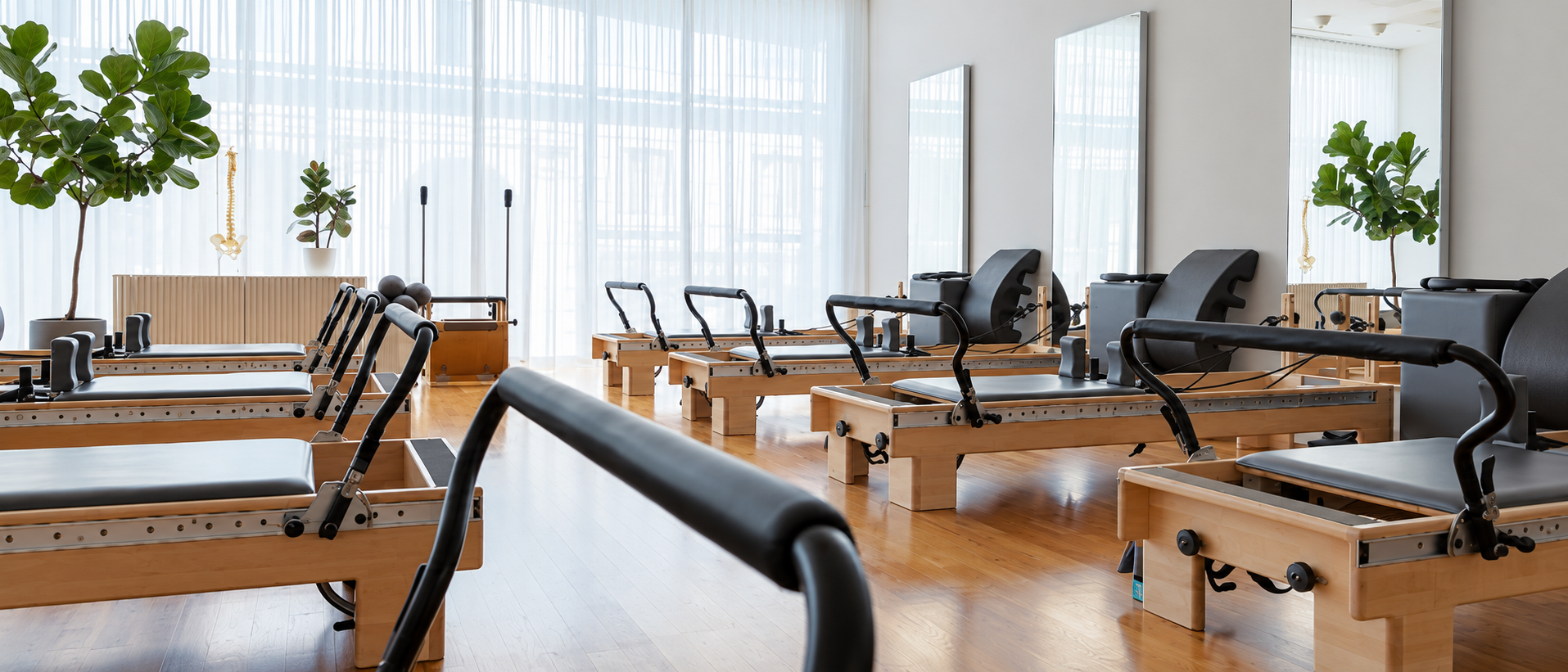 The MTLPILATES studio at 1440 Rue Peel, rows of reformers in wide natural light